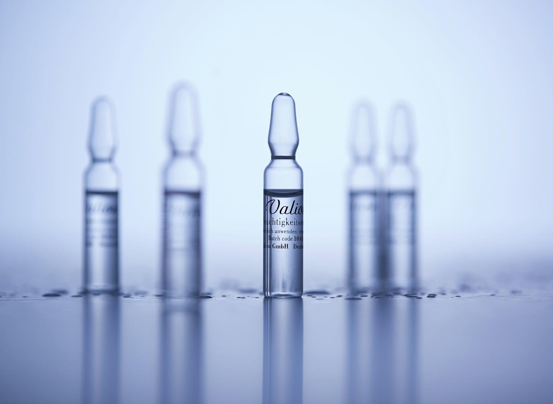 a group of small bottles sitting on top of a table