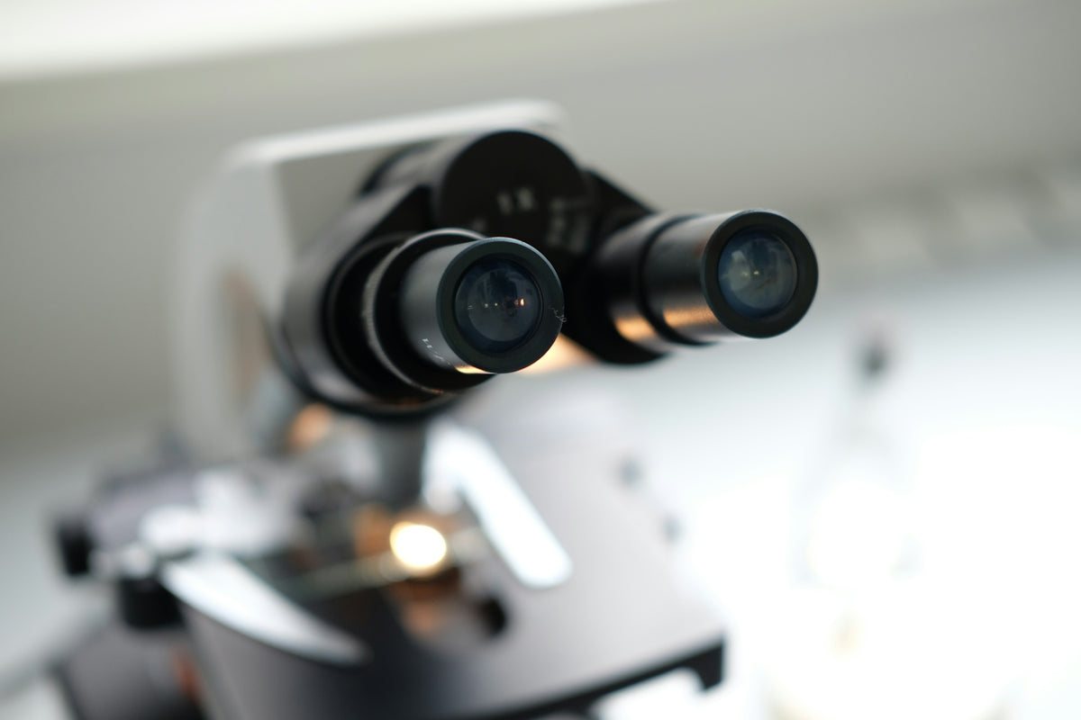 A close up of a camera on a tripod